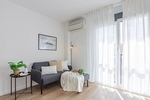 Apartment, 1 Bedroom | Living room | 22-inch flat-screen TV with digital channels