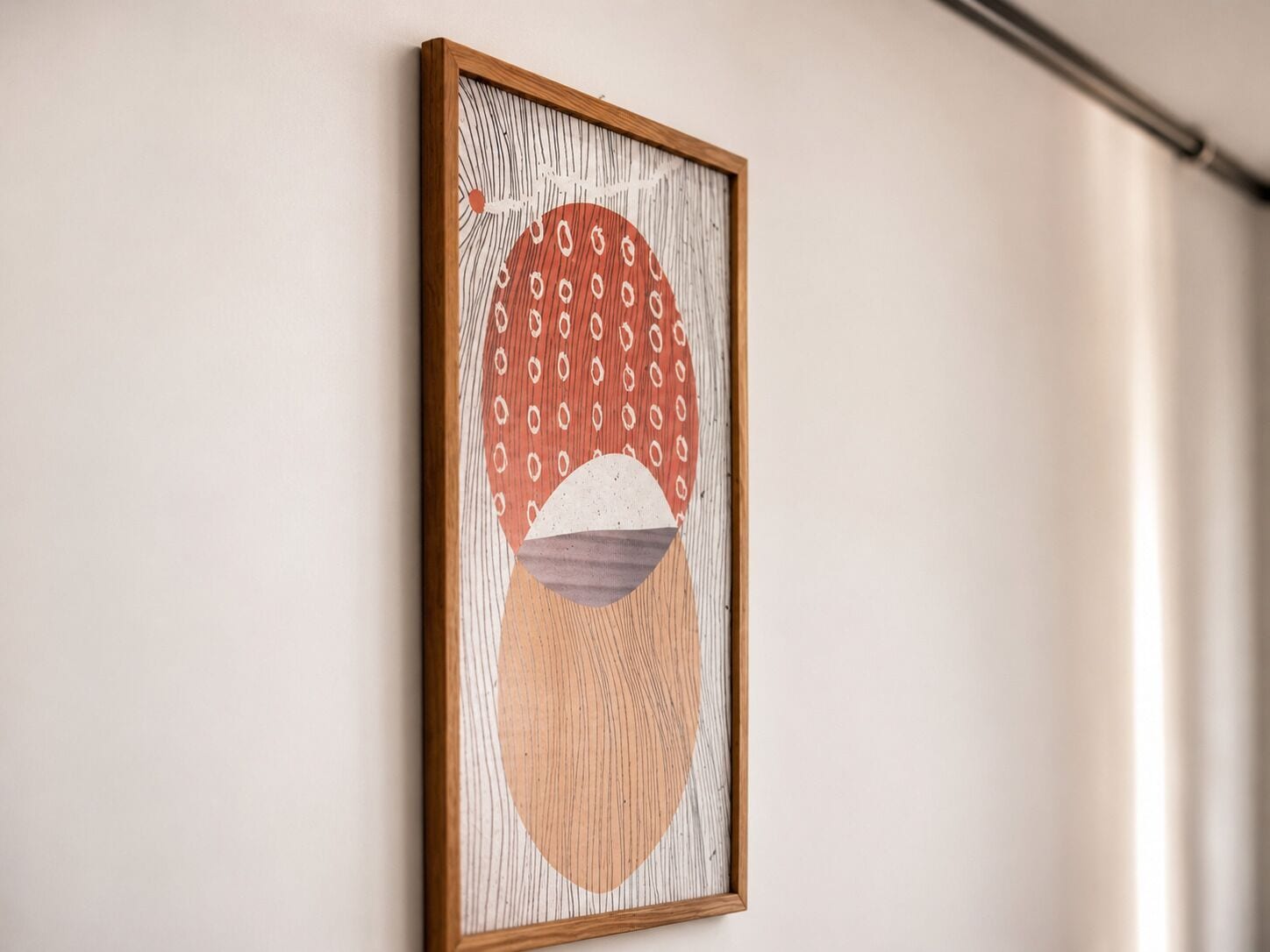 A framed artwork with abstract patterns and shapes.