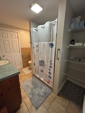 Shower, hair dryer, towels, soap