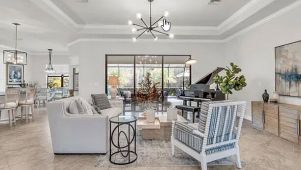 A spacious living room with a piano, a white sofa, a striped chair, and a large window. - Looking for last minute X-mas plans?  Beautiful home in Fort Myers - 7 days min. (Fort Myers)