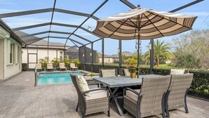 An outdoor patio with a pool, wicker furniture, and a pergola with a canopy. - Looking for last minute X-mas plans?  Beautiful home in Fort Myers - 7 days min. (Fort Myers)