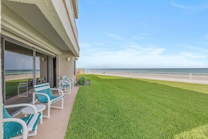 A hotel balcony with a view of the beach and ocean. - Errol By The Sea 126 (New Smyrna Beach)