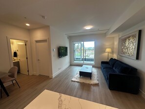 Living area - Modern 1BR Suite at The Royale w/ Deck & Parking (Victoria)