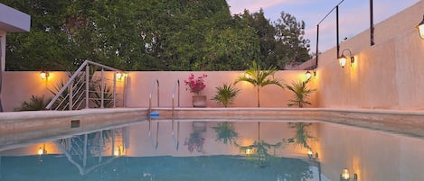 Outdoor pool, open 7:00 AM to 10:00 PM, pool umbrellas