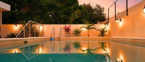 Outdoor pool, open 7:00 AM to 10:00 PM, pool umbrellas