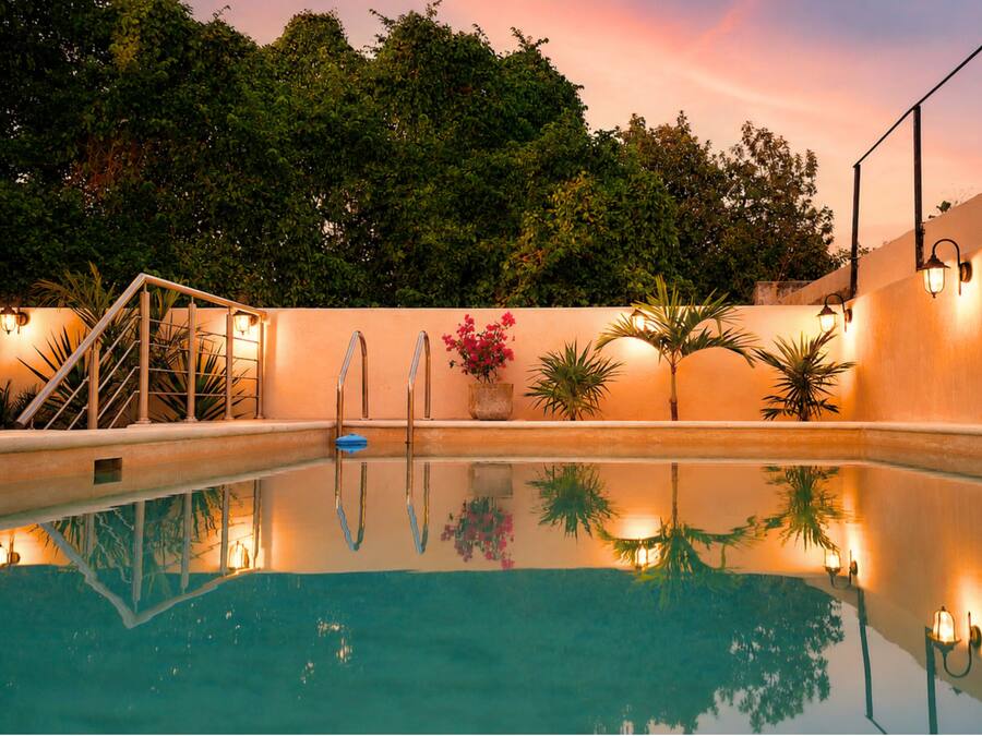 Outdoor pool, open 7:00 AM to 10:00 PM, pool umbrellas