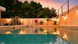 Outdoor pool, open 7:00 AM to 10:00 PM, pool umbrellas