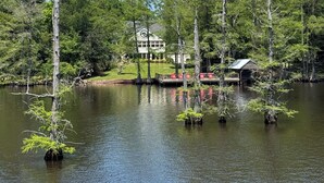 A lakeside property with a large house, dock, and several small structures. - Horton House SLEEPS 16, no pets or unapproved parties (Monroe)
