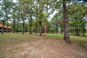 Children’s area - Adventure Acres Log Cabin – Zipline, Arcade, Fishing, Bluey themed room & More! (Cushing)