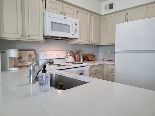 Chic, well-appointed 1-bedroom poolside condo with loft