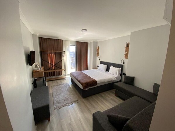 Economy Suite, Balcony, City View | Desk, laptop workspace, blackout drapes, iron/ironing board - Taksim Didriot Hotel (İstanbul)