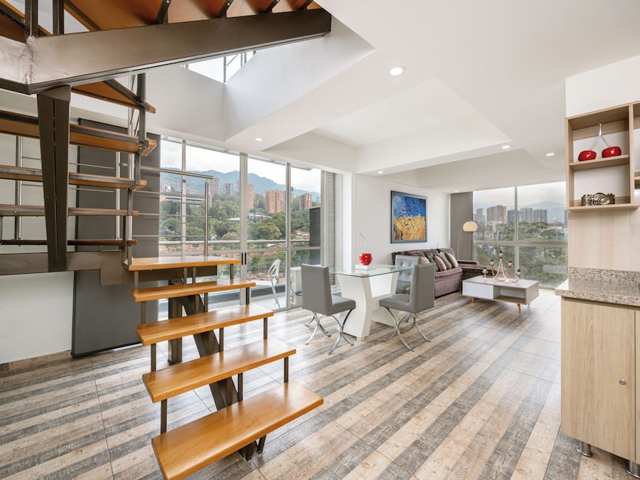 Deluxe Duplex, Balcony, City View | Living area | 50-inch Smart TV with cable channels