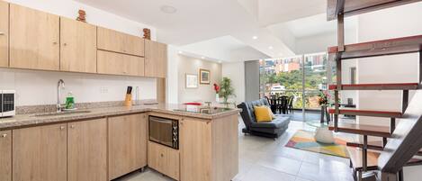 Superior Duplex, Balcony, City View | Private kitchen | Full-size fridge, microwave, stovetop, cookware/dishes/utensils