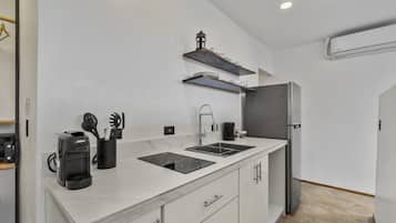 Fridge, stovetop, coffee/tea maker, cookware/dishes/utensils