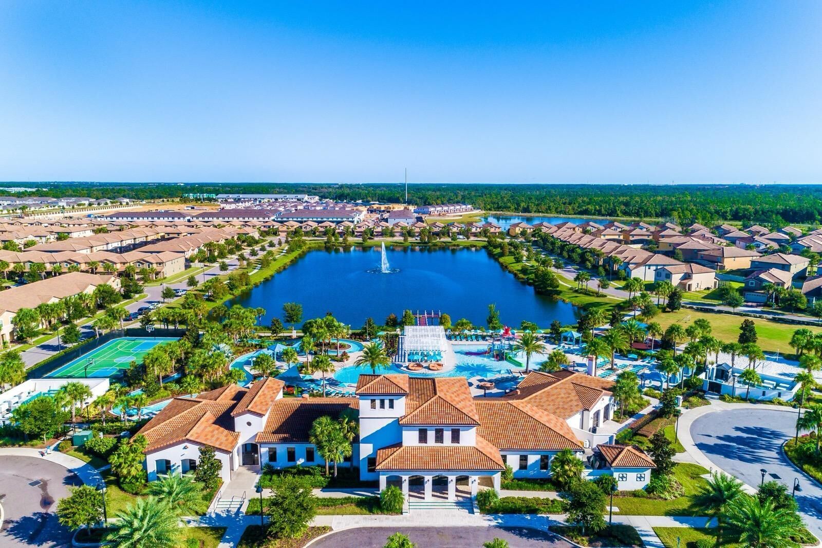 A resort with a central lake, a water park, and residential buildings.