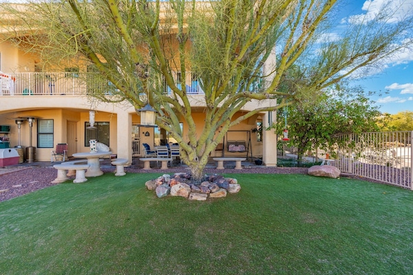 View of entry to casita along with synthetic grass yard.