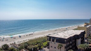 A beach view with a building in the foreground. - Myrtle Beach Quiet Coastal Getaway | Great Ocean & Coast Views (Myrtle Beach)