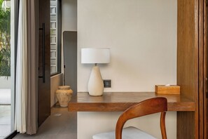 A modern room with a wooden desk, a white vase, and a lamp. - Lago Villas - Charming 1bed villa with Pool in Uluwatu (Uluwatu)