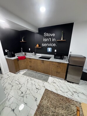 Fridge, microwave, electric kettle, cookware/dishes/utensils