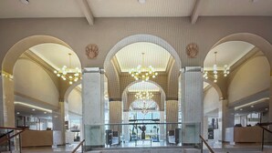 A spacious lobby with high ceilings, arched columns, and a central fountain. -  Available Dec 20-27th Christmas in the Sun 2bdrm 3 bath Luxury Condo In Cancun! (Cancún)