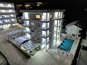 Outdoor pool, open 8:00 AM to 8:00 PM, free cabanas, pool umbrellas