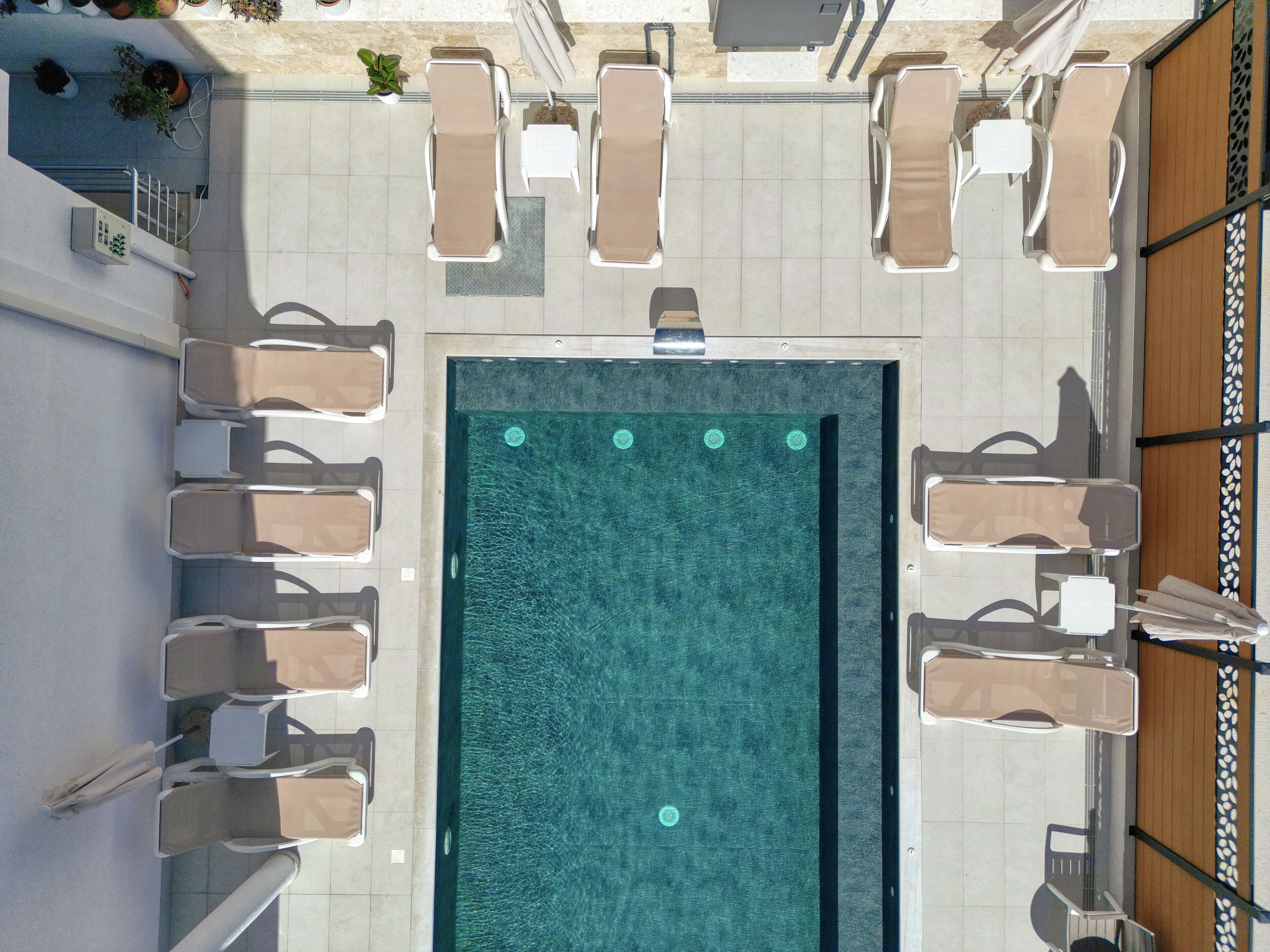 Outdoor pool, open 8:00 AM to 8:00 PM, free cabanas, pool umbrellas