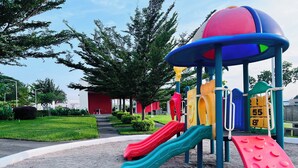 A playground with multiple slides and climbing structures. - Nala House  (Nuevo Sitio del Nino)