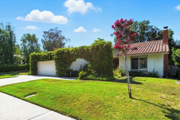 Peaceful Westlake Village vacation home with ivy arch and modern curb appeal.