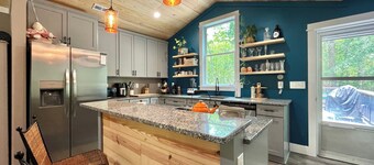 3-br cabin with Private Dock on the River, covered porch and large back deck