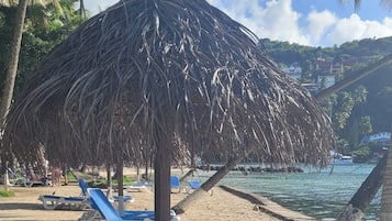 On the beach, sun loungers, beach towels