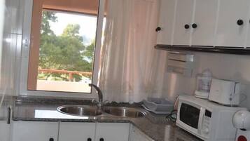 Fridge, microwave, cookware/dishes/utensils