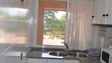 Fridge, microwave, cookware/dishes/utensils