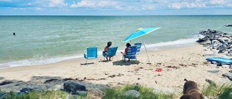 On the beach, sun loungers, beach towels