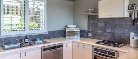 Comfort House, Ocean View | Private kitchen | Toaster, eco-friendly cleaning products, freezer, paper towels