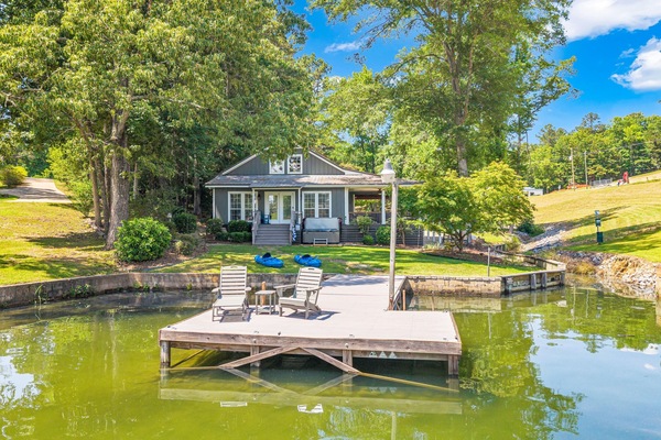 Waterfront retreat with private dock, spacious yard, and stunning lake views.