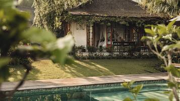 Outdoor pool, open 7:00 AM to 6:00 PM, pool umbrellas, pool loungers