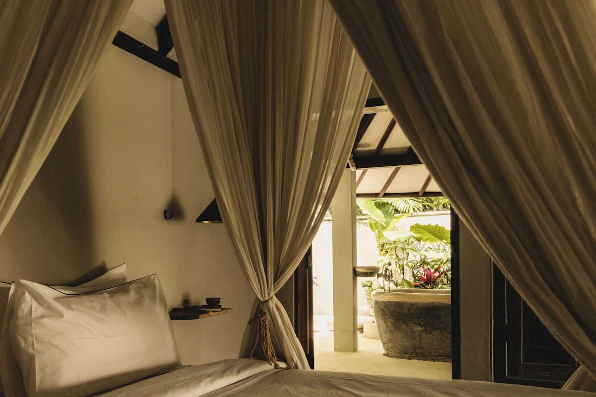 Bungalow, Pool View | Minibar, in-room safe, individually furnished, desk
