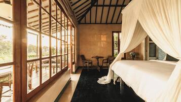 Suite, Pool View | Minibar, in-room safe, individually furnished, desk