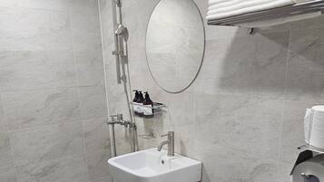 Twin Room (No Parking) | Bathroom | Shower, free toiletries, hair dryer, slippers