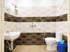 Shower, rainfall showerhead, slippers, towels