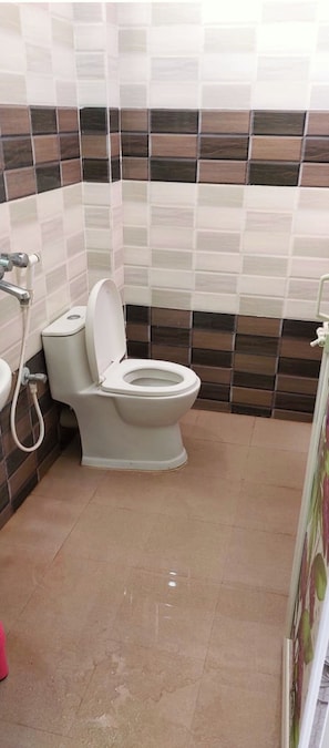 Shower, rainfall showerhead, slippers, towels