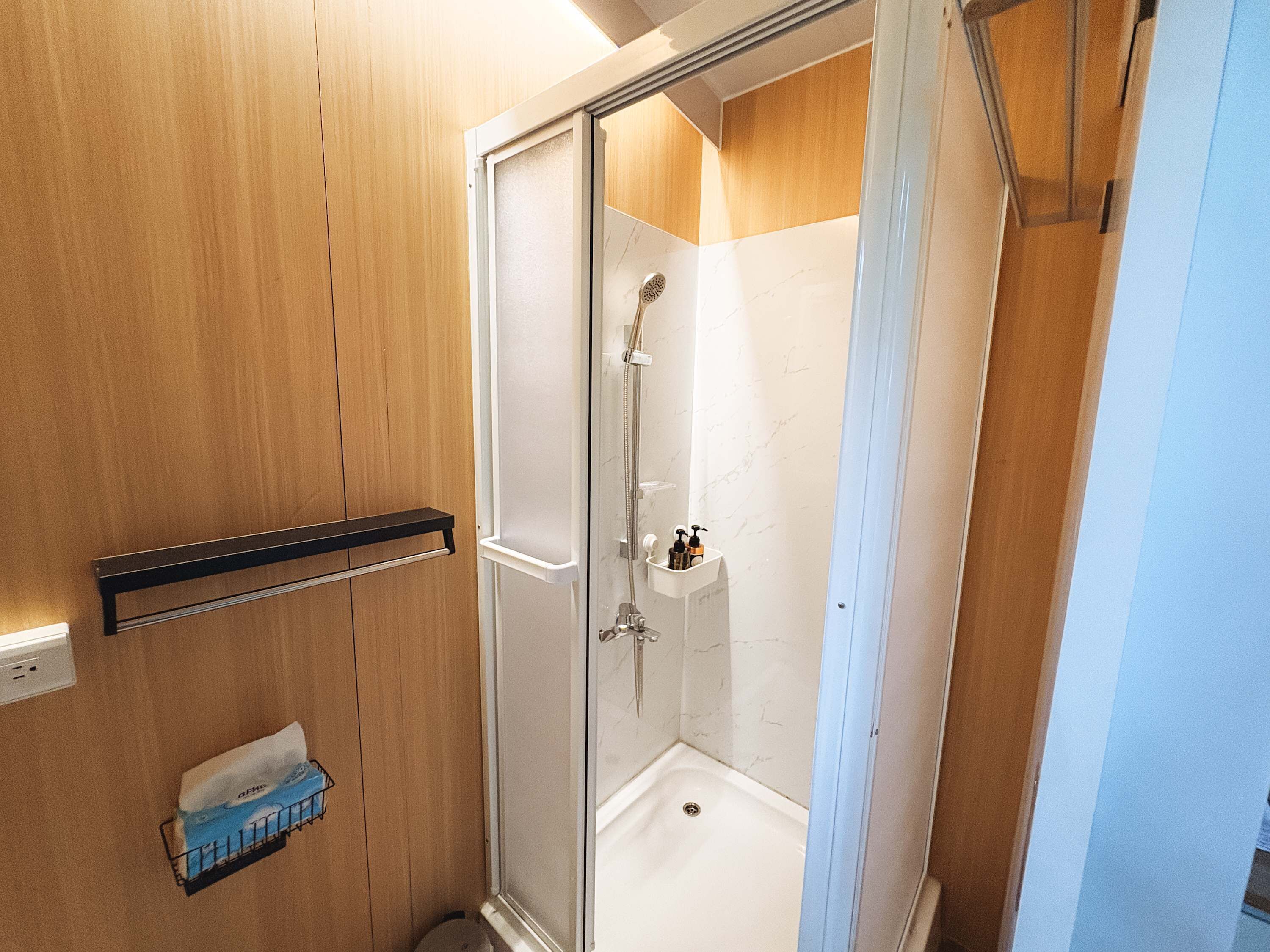 Shower, hair dryer, towels, shampoo