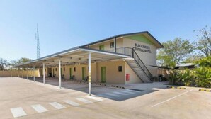 A building labeled "Blackwater Central Motel" with a covered parking area and a staircase leading to the entrance.