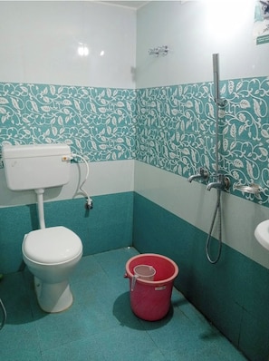 Shower, rainfall showerhead, slippers, towels