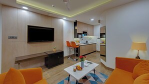 Junior Suite | Living area | 32-inch flat-screen TV with cable channels - AR Suites Sohna Road (Gurugram)