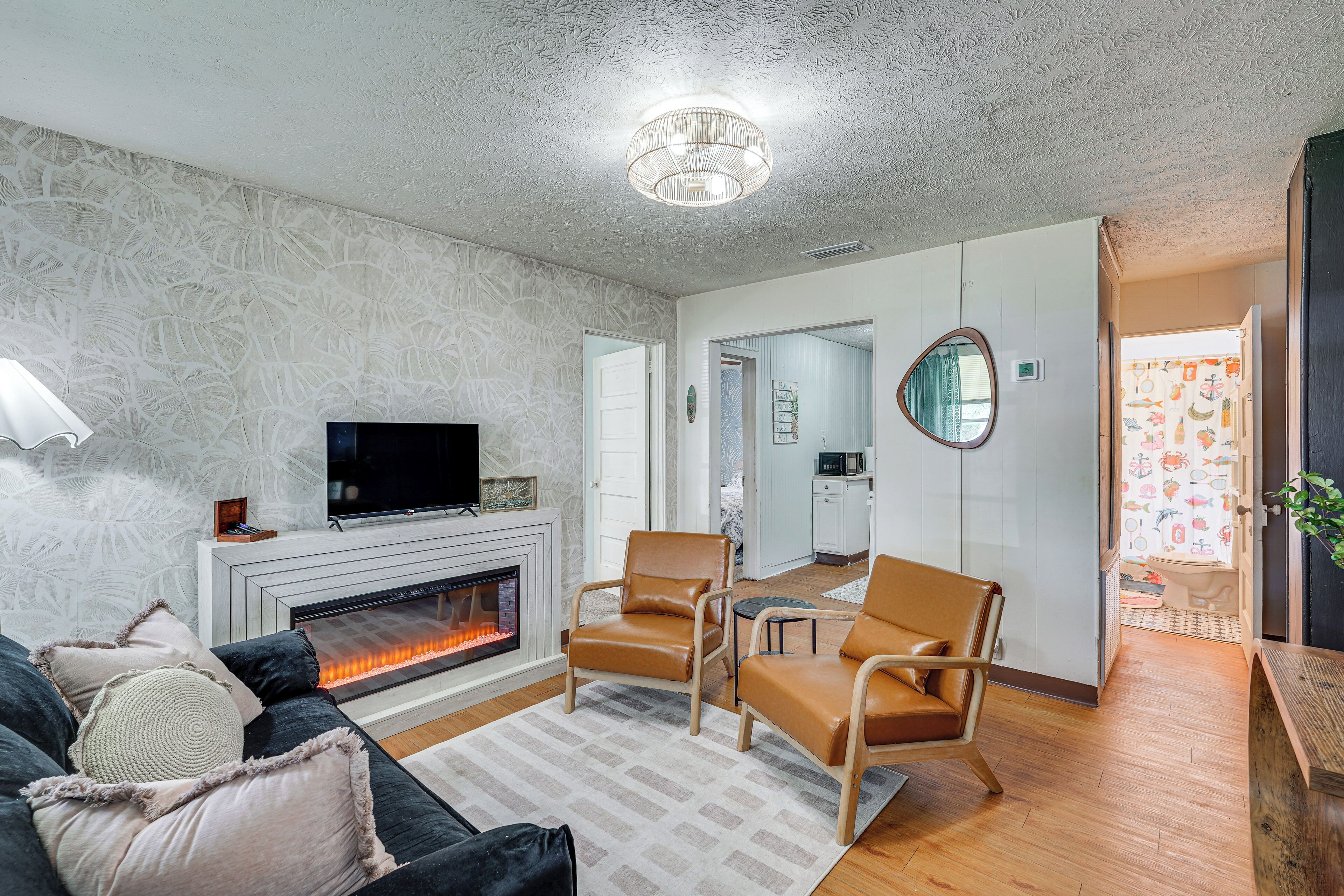 TV, fireplace, books