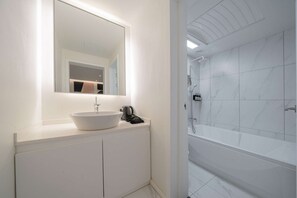 Premium Studio Suite | Bathroom | Hair dryer, heated floors, towels, soap - From H About Hotel Chungju (Chungju)