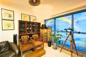 Suíte premium, vista para a praia | Área de estar