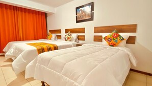A hotel room with two beds, orange curtains, a framed picture on the wall, and a wooden headboard. - Hotel Residencia Inn Cuzco (Cusco)