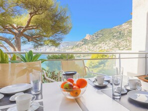 A table set for breakfast with a clear view of a coastal landscape. - Parc Massolin by Interhome (Roquebrune Cap Martin)